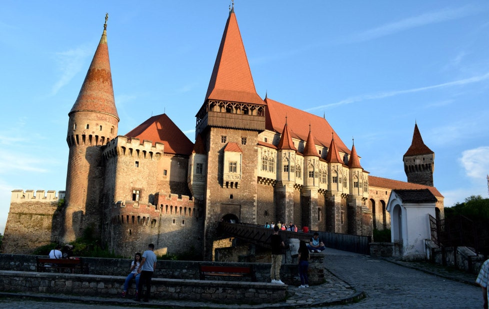 Front view of Corvin Castle at sunset